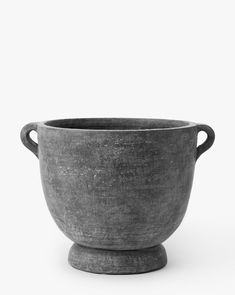 a large gray bowl sitting on top of a table