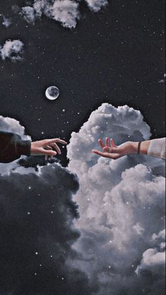 two hands reaching out to each other in the sky with clouds and moon behind them