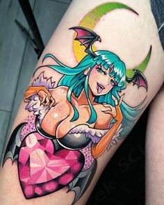 a woman with blue hair and tattoos on her leg is holding a pink heart shaped object