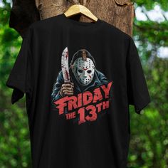 a friday the 13th t - shirt hanging on a tree