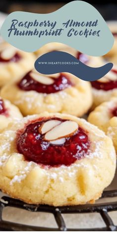 raspberry almond thumbnut cookies on a cooling rack with text overlay reading raspberry almond thumbnut cookies