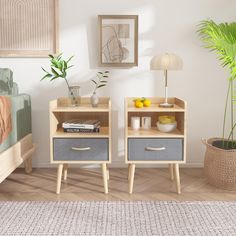 two nightstands with books and fruit on them in a bedroom area next to a bed