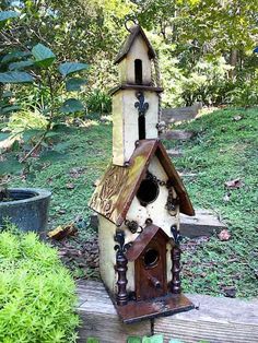 a bird house made out of wood and metal