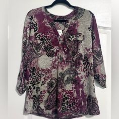 **Nwt** Brand: Stitch Collection Size: L Beautiful Paisley And Animal Print Top In Purple, Black And Gray. This Top Includes: -Three Quarter Rolled Tab Sleeves - V-Lined Neckline - Black And Silver Functional Buttons - Front Pocket Design On Front -Rounded Hem Material: 95% Polyester 5% Spandex P2p- 21-23” L- 27” Front Pocket Design, Stitch Collection, Black And Gray, Black And Silver, Purple Black, Print Top, Pocket Design, Purple And Black, Three Quarter