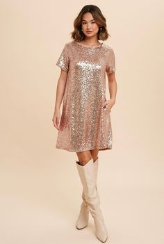 Your next night out calls for the Swifty Sequin Shirt Dress In Rose Gold! Shimmering sequins deck out this stunning shift dress with a round neckline, short sleeves, and a flirty mini-hem length. Get ready for the compliments! Fully lined for comfort Round neckline Short sleeves Sparkle sequin dress Low V back Invisible side pockets Stretchy 95% Polyester, 5% Spandex Wash cold, dry flat Runs slightly small- See item measurements for details Please note sizes 1XL-3XL have a contrast lace edge & l Taylor Swift Sequin Dress, Taylor Swift Sequin, Champagne Sequin Dress, Sequin T Shirt Dress, Sequin Shirt Dress, Sequin Tshirt, Eras Outfit, Rose Gold Sequin Dress, Dress Sparkle