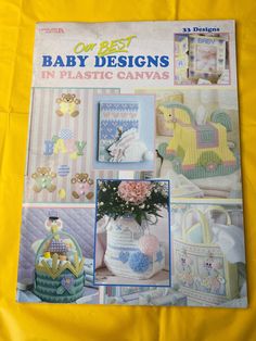 a magazine with pictures of baby designs in plastic canvass