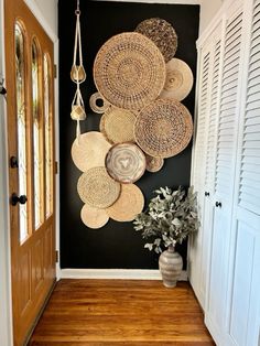 an entry way with baskets on the wall