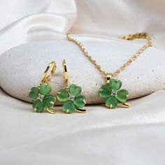 Gold Filled Clover Necklace, 4 Leaf Necklace,  Luck Necklace, Four-Leaf Clover, Shamrock Jewelry, Shamrock Necklace, Christmas Gift, Jade   Size & Material & Other Details ∙ Clover Pendant Size: 12mm x12mm ∙ Material: 14K Gold Filled over Brass and C Class Jade ∙ The necklace comes with 2 inch extender. If you want to remove it, please let us know. ∙ For Earrings:  ∙ Hoop Size: 12mm  Turnaround Time: * NEXT DAY * We will ship it the next business day if orders are placed between 8 AM-4 PM on wee Shamrock Jewelry, Shamrock Necklace, Elegant Gift Wrapping, Luck Necklace, Good Luck Necklace, Clover Design, Clover Pendant, Simple Gift Wrapping, Clover Earrings