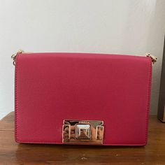 Gorgeous Ruby With Gold Detail Furla Mimi Purse. This Purse Has Never Been Used And It Has The Original Dust Bag. Tags Are Still On The Purse. Elegant Shoulder Bag With Branded Hardware As A Gift, Elegant Red Square Bag, Formal Square Pink Shoulder Bag, Formal Pink Square Shoulder Bag, Elegant Red Formal Shoulder Bag, Elegant Formal Red Shoulder Bag, Elegant Red Shoulder Bag With Chain Strap, Elegant Red Shoulder Bag, Elegant Red Crossbody Bag