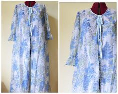 Vintage 1970's negligee / brunch coat ~ super sweet original vintage robe/dressing gown in semi sheer nylon with large blue floral pattern, sweet half sleeves with ruffle details, buttons all the way down and a ribbon tie at the neck. Honestly wear it as a dress, it's that cool! MATERIAL nylon CONDITION excellent! SIZE Fits a range of sizes from small to large, it is marked 12-34 which may mean it's intended for a 34 inch bust  MEASUREMENTS Taken across lying flat (double for circumference) unde Long Sleeve Floral Print Nightgown For Spring, Blue Spring Robe For Loungewear, Spring Floral Print Fitted Robe, Spring Daywear Long Sleeve Robe, Fitted Floral Print Spring Robe, Fitted Floral Print Robe For Spring, Fitted Spring Daywear Robe, Fitted Robe For Spring Daywear, Blue Nightgown For Spring Loungewear