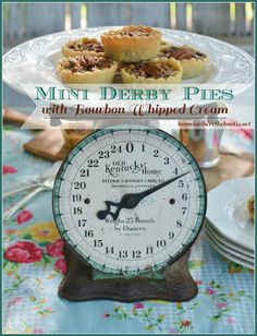 mini pies with bourbon whipped cream are on a plate next to a small clock