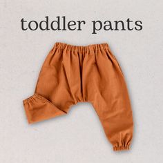 an orange pants with the words todder pants written in black and white on it