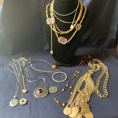 This listing is for a vintage lot of 10 different necklaces. There is a lovely gold toned one with purple/lavender stones, a circular rhinestone pendant,  another large focal  pendant with amethyst faceted stone, silver toned   a tasseled necklace, a #1 Mom pendant, a lariat style necklace, and more. These are all vintage and in very nice condition, like new! All included in this lot. Please see pictures for more details. This will be shipped to you in sturdy box. We do combine shipping! Cheap Vintage Necklaces With Large Pendant, Luxury Vintage Necklace With Large Pendant, Luxury Vintage Jewelry With Large Pendant, Gold Metal Necklace For Accessorizing, Antique Round Purple Necklace, Purple Metal Costume Jewelry Necklaces, Costume Jewelry For Accessorizing, Vintage Long Necklace With Coin Pendant, Costume Jewelry Crystal Necklace With Jewels