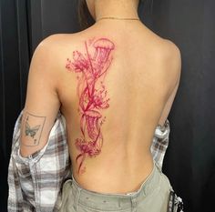 a woman with a tattoo on her back