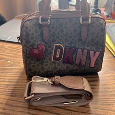 Dkny Women's Bryant Monogram-Print Logo-Patch Faux-Leather Top-Handle Bag. New Without Tags. Send An Offer Brown Satchel Bags With Logo Hardware, Dkny Bryant Crossbody Bag, Dkny Suitcase, Dkny Shoulder Bag, Dkny Shirt Women, Dkny Bag, Faux Leather Top, Monogram Prints, Monogram Bag