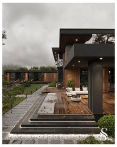 a modern house with wooden decking and outdoor furniture