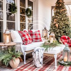 a christmas porch decorated for the holiday season