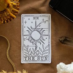 the sun tarot sitting on top of a table