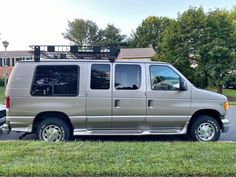 a silver van parked on the side of a road