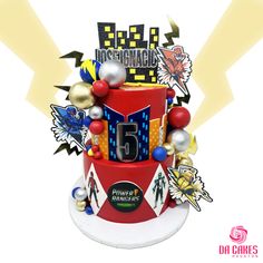 a red cake with decorations on it and the number five surrounded by other items that appear to be made out of legos