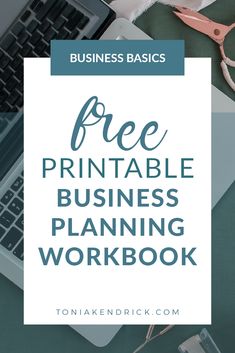 a laptop computer sitting on top of a desk with the words free printable business planning workbook