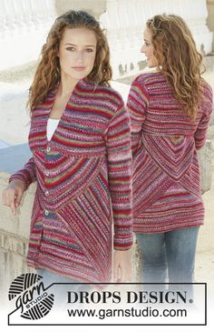 two women standing next to each other wearing sweaters