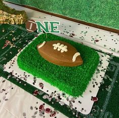 a football themed cake on top of a table