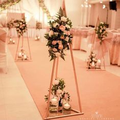 an aisle decorated with flowers and candles