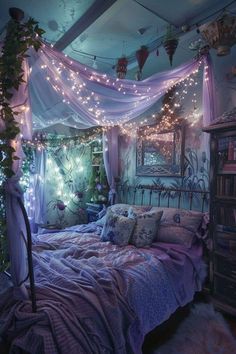 a bed with purple sheets and lights hanging from the ceiling