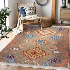 a room with a chair and rug on the floor