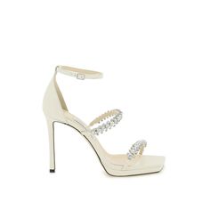 Jimmy Choo's "Bing" Sandals Made Of Smooth Leather And Featuring Crystal-Studded Straps. Adjustable Ankle Strap, Leather Footbed And Leather Sole. Materal: 100% Lambskin. Made In: Italia. Color: White. Collection: Fall - Winter 2023. Sku: Bing Sandal 105 Ndh. Heel Height: 10,5 Cm. Modecraze Is An Online Platform That Offers The Best Designer Products From Europe To Customers All Over The World. Our Exclusive Partnerships With European Retailers Ensure That We Curate A Wide Selection Of Authentic Luxury Wedding Sandals With Reinforced Heel, Leather Sandals With Reinforced Heel For Wedding, Designer Ankle Strap Sandals For Wedding, Luxury Leather Sandals For Wedding, Designer Wedding Sandals With Heel Strap, Designer Wedding Sandals With Round Toe, Jimmy Choo Bing, Jimmy Choo Bridal, Jimmy Choo Gold