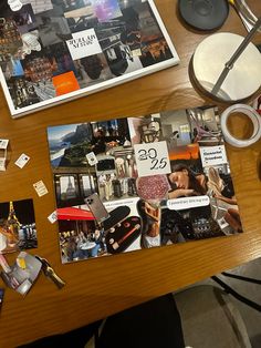 a wooden table topped with pictures and other items