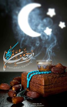 an arabic greeting card with almonds and tea in front of a crescent moon on a black background