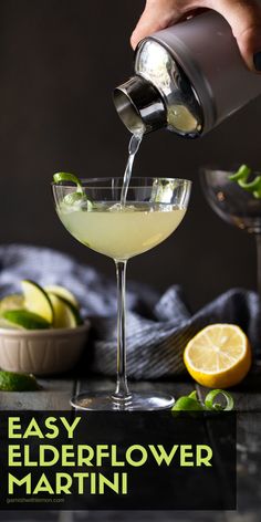 someone pouring a drink into a martini glass with limes around it and the words elderflower martini written below