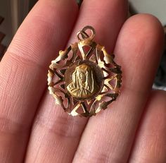 This is a beautiful vintage, Italian Virgin Mary/Theotokos medal made from 18k gold. Absolutely gorgeous details, hallmarked on the back. As always, Mary's goodness and light shine through. More photos and products can be found on Instagram @little_bell_vintage Please look at all the photos thoroughly. Purchasing implies you have studied the photos, asked me questions, and agree with the items condition, which may show signs of wear. Some antique and vintage items are anywhere from 20-150 years old, and may have scratches and other imperfections. Yellow Gold Medallion For Commemoration, Gold Spiritual Locket Jewelry And Charms, Spiritual Yellow Gold Wedding Jewelry And Charms, Gold Miraculous Medal Jewelry For Memorial, Gold Jewelry With Miraculous Medal For Memorial, Spiritual Yellow Gold Coin Pendant, Gold Spiritual Jewelry And Charms For Wedding, 14k Gold Medallion For Commemoration, Gold Vintage Charm Jewelry For Commemoration