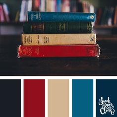 a stack of books sitting on top of each other in front of a book shelf