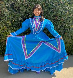 This dress from Jalisco made from poplin, features colorful ribbons throughout the dress.  Jalisco Medio Vuelo ( half circle) dress    material: Popeline and poliéster with cotton  JALISCO DRESS MEASUREMENTS  SIZE 2 26'' waist 24'' chest  26'' shoulder to ankle (long)  SIZE 4 28"waist 26" chest 28"shoulders to ankle  (long)  SIZE 6 30" waist  30"chest  34"shoulders to ankle  (long)  SIZE 8 33" waist  32"chest  34"shoulders to ankle  (long)  SIZE 10 35"waist  34"chest  41" shoulders to ankle  (lo Jalisco Dress, Fiesta Dress, Wide Skirt, Girls Costumes, Girls Pink Dress, Circle Dress, Mexican Girl, Full Dress, Green Outfit