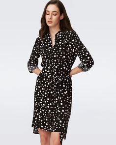 Cut from a soft crepe, the Prita has an effortless feel with a tailored look. Relaxed in drape, this shirt dress has fabric-covered buttons down the center, long sleeves that cinch at the cuff, a high-low hem, and a classic collar. Highlight the waist with a belt, or wear the silhouette as an easy shape like Diane does. LENZING™ ECOVERO™ Viscose fibers are created from renewable wood sources and manufactured using less water and emitting less CO2. Better for the environment, better for your styl Elegant Shirt Dress With Roll-up Sleeves For Daywear, Fall Workwear Dresses With Roll-up Sleeves, Classic Long Sleeve Viscose Dress, Chic Shirt Dress With Roll-up Sleeves For Daywear, Elegant Collared Shirt Dress With Roll-up Sleeves, Chic Shirt Dress With Roll-up Sleeves And Spread Collar, Elegant Shirt Dress With Roll-up Sleeves And Spread Collar, Viscose Button-up Shirt Dress For Work, Long Sleeve Rayon Dress For Work