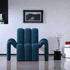 a living room filled with furniture next to a white wall