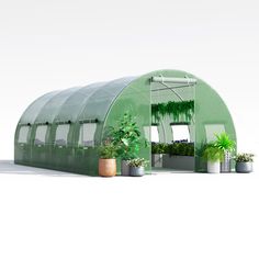 a green house with potted plants in it