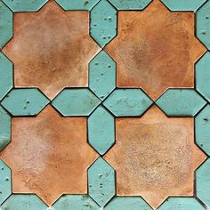 a close up view of some tiles on the floor with blue and brown colors in it