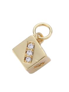 a yellow gold charm with three diamonds on the front and back of it's clasp