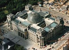 an aerial view of a large building under construction