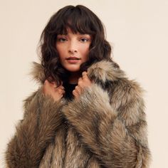 Trendy Fluffy Fur Coat For Fall, Trendy Faux Fur Coat With Trim, Fall Outerwear With Faux Fur Trim, Fall Faux Fur Outerwear With Feather Trim, Chic Faux Fur Outerwear With Feather Trim, Faux Fur Lined Outerwear For Fall, Faux Fur Outerwear With Lining For Fall, Trendy Faux Fur Coat, Trendy Faux Fur Coat With Faux Fur Lining