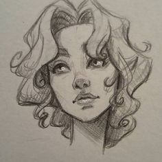 a pencil drawing of a woman's face with curly hair and blue eyes,