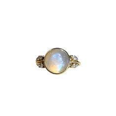 Metaphysically moonstone is known to bring a balancing yin energy to its wearer. This masterfully set iridescent moonstone brings the magic in its 14k yellow gold bezel setting, flanked by eight sparkly diamonds in their whimsical leaf settings. Features a bezel-set approx. 11 x 8mm moonstone Eight flush-set approx. 1mm diamonds Currently size 8, size-able Because we do all our restoration work by hand we can offer a huge array of customization! If you have inquiries about sizing, alterations, o Yin Energy, Velvet Ring Box, Paper Jewelry, Buying Jewelry, Ring Box, Antique Items, Bezel Setting, Antique Jewelry, Fashion Rings