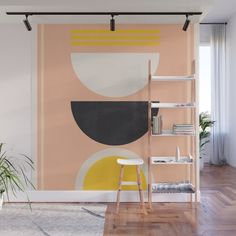 an abstract painting with yellow, black and white shapes on a pink background wall mural