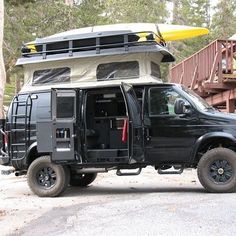 a black truck with a kayak on the roof