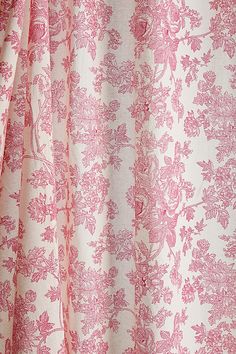 a pink and white floral print curtain