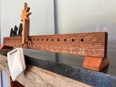 a close up of a wooden cross on top of a shelf